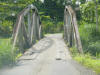 tropical hardwood bridge over Rio Arenal (Arenal River)